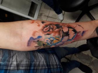 León en acuarela tatuaje realizado por Benjamín Churros